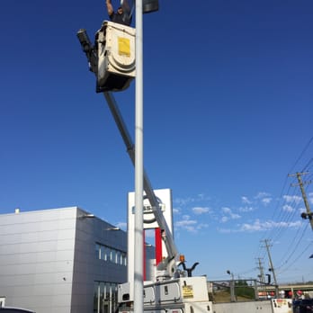 K2 Electrical - K2 bucket truck in use at local car dealership. - Electricians Near Me - West Milford, New Jersey K2 Electrical - K2 bucket truck in use at local car dealership. - Electricians Near Me - West Milford, New Jersey