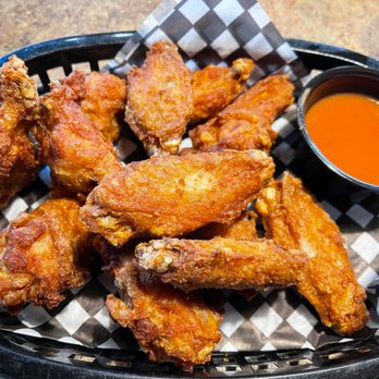 The Reach Neighbourhood - a basket of chicken wings with dipping sauce - Sports Bars Near Me - Maple Ridge, British Columbia The Reach Neighbourhood - a basket of chicken wings with dipping sauce - Sports Bars Near Me - Maple Ridge, British Columbia