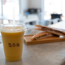 SOG Cafe - Our popular combo.. Tropical vibe smoothie accompanied by our famous Cuban Sandwich