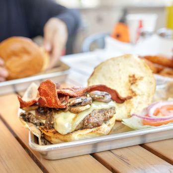 Superburger - Mushroom Swiss Bacon Burger $10.50 "our grilled burger topped with applewood smoked bacon, garlic mushrooms, Swiss cheese, plus fixings" - American Near Me - Windsor, California