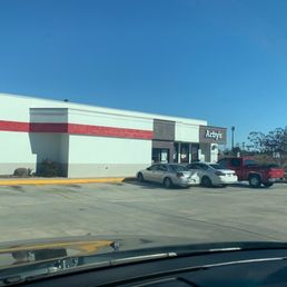 cars parked in front of a store cars parked in front of a store