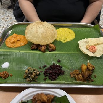 Vedha's Kalyana Virunthu - banana leaf weekend unlimited meal. just a fraction of what the staff brought out for him to try - Indian Near Me - Frisco, Texas Vedha's Kalyana Virunthu - banana leaf weekend unlimited meal. just a fraction of what the staff brought out for him to try - Indian Near Me - Frisco, Texas