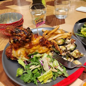Nando's Peri-Peri - 1/2 Chicken PERi Chips Crispy Brussels Sprouts Mixed Leaf Side Salad - Portuguese Near Me - Washington, DC, District of Columbia Nando's Peri-Peri - 1/2 Chicken PERi Chips Crispy Brussels Sprouts Mixed Leaf Side Salad - Portuguese Near Me - Washington, DC, District of Columbia