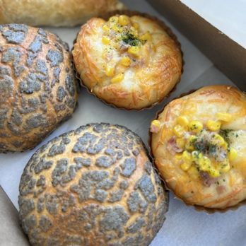Cloverleaf Coffee & Bakery - Black sesame pineapple bun  Ham & corn Blue berry turnover       IG : @abgwhoeats - Desserts Near Me - Temple City, California