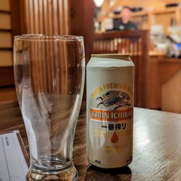 a beer and a glass on a table a beer and a glass on a table