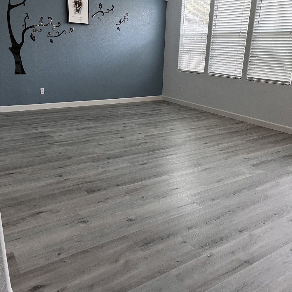 Ramirez Carpet Service - After fam room w/ brand new vinyl plank floor - Carpet Installation Near Me - Oakland, California