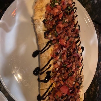 Downtown City Tavern - Bruschetta Loaded Slipper - Pizza Near Me - Glens Falls, New York Downtown City Tavern - Bruschetta Loaded Slipper - Pizza Near Me - Glens Falls, New York