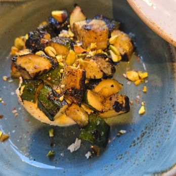 Meril - Grilled zucchini with stracciatella, lemon balsamic, and pistachio - New American Near Me - New Orleans, Louisiana Meril - Grilled zucchini with stracciatella, lemon balsamic, and pistachio - New American Near Me - New Orleans, Louisiana