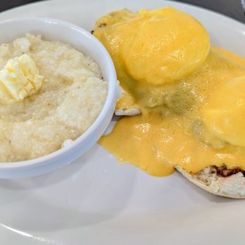 Eggs Up Grill - Piping hot grits with the house-made corned beef, Benedict-style. - Waffles Near Me - Hampstead, North Carolina Eggs Up Grill - Piping hot grits with the house-made corned beef, Benedict-style. - Waffles Near Me - Hampstead, North Carolina