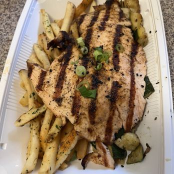 California Fish Grill - ATLANTIC SALMON with FRENCH FRIES and DICED ZUCCHINI & ROSEMARY with Miso Sauce on the side. The miso kicks everything up a notch! - Seafood Near Me - Costa Mesa, California
