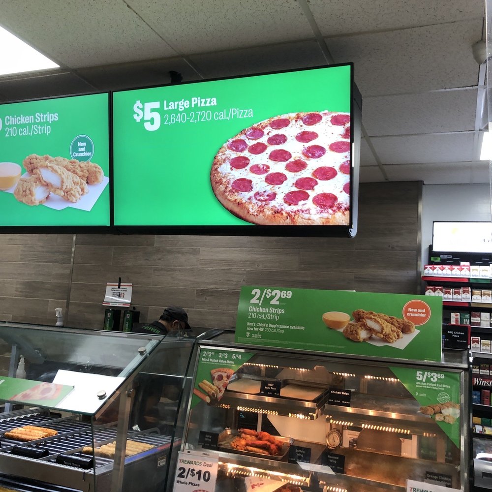 a display of pizzas in a store