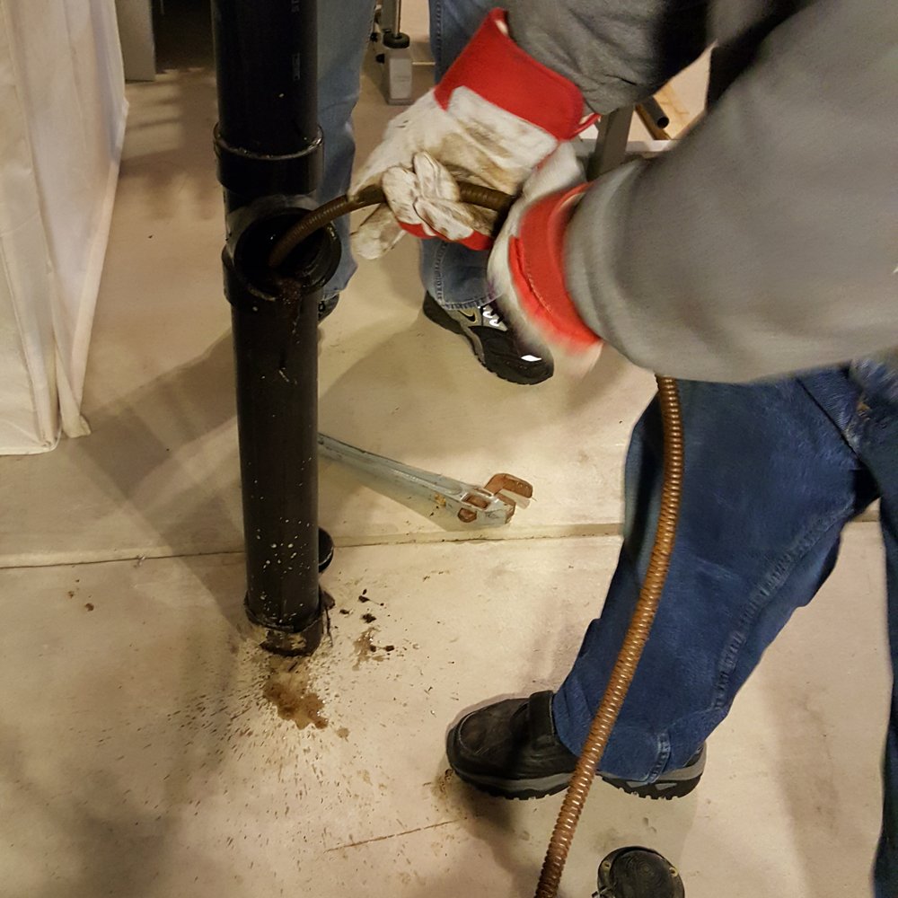 Jimmy Rooter - Jimmy pushing and rotating snake pipe to "cut up" or push thru the blockage. - Plumbing Near Me Jimmy Rooter - Jimmy pushing and rotating snake pipe to "cut up" or push thru the blockage. - Plumbing Near Me