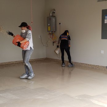 Diamond Cut Garage Floors - Interesting to watch Sasha spread the flakes - Flooring Near Me