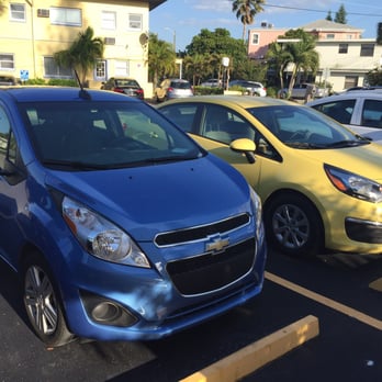 Hertz Rent A Car - They said I was supposed to get a car similar to a Kia Rio which is the yellow car. Instead they put me in a much smaller Chevy spark. - Car Rental Near Me - Tampa, Florida Hertz Rent A Car - They said I was supposed to get a car similar to a Kia Rio which is the yellow car. Instead they put me in a much smaller Chevy spark. - Car Rental Near Me - Tampa, Florida