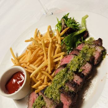 The River House - Steak Frites , sliced steak house served with sauce verte that adds a buttery touch to it. The french fries were thin-cut (yum) - Seafood Near Me - Palm Beach Gardens, Florida The River House - Steak Frites , sliced steak house served with sauce verte that adds a buttery touch to it. The french fries were thin-cut (yum) - Seafood Near Me - Palm Beach Gardens, Florida