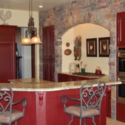 Inside-Out Designs - New construction European style kitchen with beautiful stone accent wall