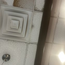 IHOP - Nasty unknown liquid and stuff falling / ooooozzzing from the dark stained, fuzzy, liquid soaked tiles.