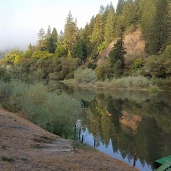 Grandma's House - The house's dock area and a separate beach area to the right has canoes and kayaks.