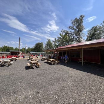 Log Home Brewing - Outdoor area with live music and cornhole - Brewpubs Near Me - Spotsylvania Courthouse, Virginia Log Home Brewing - Outdoor area with live music and cornhole - Brewpubs Near Me - Spotsylvania Courthouse, Virginia