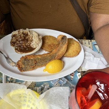 Seewee Restaurant - Flounder meal with rice and gravy, fried green tomatoes. - Seafood Near Me - Awendaw, South Carolina Seewee Restaurant - Flounder meal with rice and gravy, fried green tomatoes. - Seafood Near Me - Awendaw, South Carolina