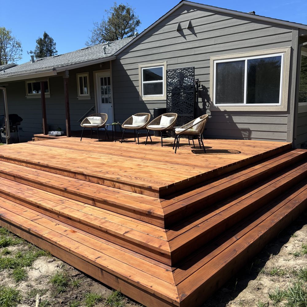 Custom Woodwork & Design - Redwood deck with waterfall stairs - Fences & Gates Near Me