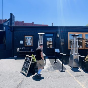 Colt Grill Bbq & Sprits - Front entrance to restaurant, with outdoor seating at right, and smoker at left - Bars Near Me - Prescott, Arizona