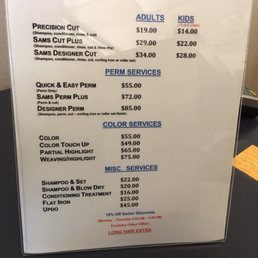 Sign says for longer hair w/o an indication of what is considered longer hair or what the charge is. Sign says for longer hair w/o an indication of what is considered longer hair or what the charge is.