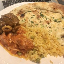 Garlic Naan Goat Curry Over Rice Butter Chicken