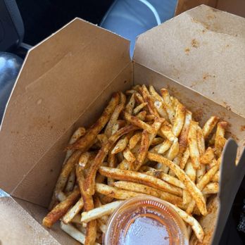 Curry Up Now - Fries with a red spicy powder on it - Indian Near Me - Decatur, Georgia Curry Up Now - Fries with a red spicy powder on it - Indian Near Me - Decatur, Georgia