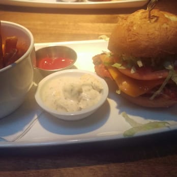 Cactus Club Cafe - CAJUN CHICKEN SANDWICH aged cheddar, lettuce, tomato. With a side of yam fries. - Canadian (New) Near Me - Delta, British Columbia Cactus Club Cafe - CAJUN CHICKEN SANDWICH aged cheddar, lettuce, tomato. With a side of yam fries. - Canadian (New) Near Me - Delta, British Columbia