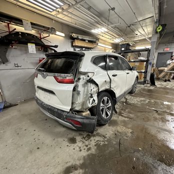 Dan's Auto Body - Honda CRV with side Damage about to be torn down for a full assessment of the damage and suspension - Body Shops Near Me - Peabody, Massachusetts