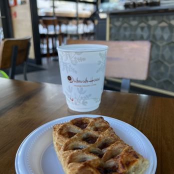 Qahwah House - Olive & tomato croissant and latte - Coffee & Tea Near Me - Oak Creek, Wisconsin Qahwah House - Olive & tomato croissant and latte - Coffee & Tea Near Me - Oak Creek, Wisconsin