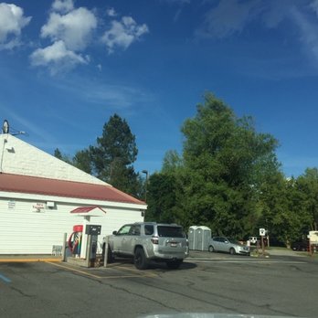 Alpine Country Store - a white truck parked in a parking lot - Convenience Stores Near Me - Hayden, Idaho