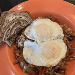 Corn beef, hash eggs over easy, rye toast Corn beef, hash eggs over easy, rye toast