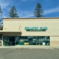Country Club Cleaners - Building exterior and parking lot.