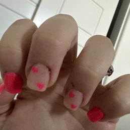 Cuticles cut on every finger. Dried blood under acrylic on middle finger.