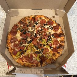 Domino's Pizza - Ultimate Pepperoni with black olives and mushrooms. Additionally, added banana peppers on one half and hamburger on the other half.