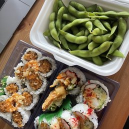 a laptop and a container of green beans a laptop and a container of green beans