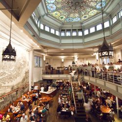 John's Pizzeria of Times Square - Main dining room of John's, including original stained glass from 19th century church.