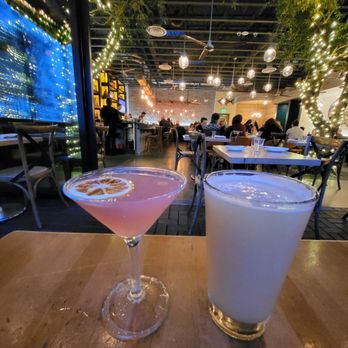 Roe Seafood Restaurant - Pomegranate Martini (left) and Picnic Lightning Hazy IPA by Brouwerij West (right) - Seafood Near Me - Long Beach, California