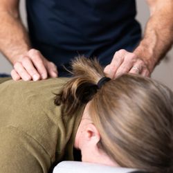 Noble Chiropractic - The gentle hands of Dr. Noble on the patient. We never force anything. Always gentle with proven, effective results.