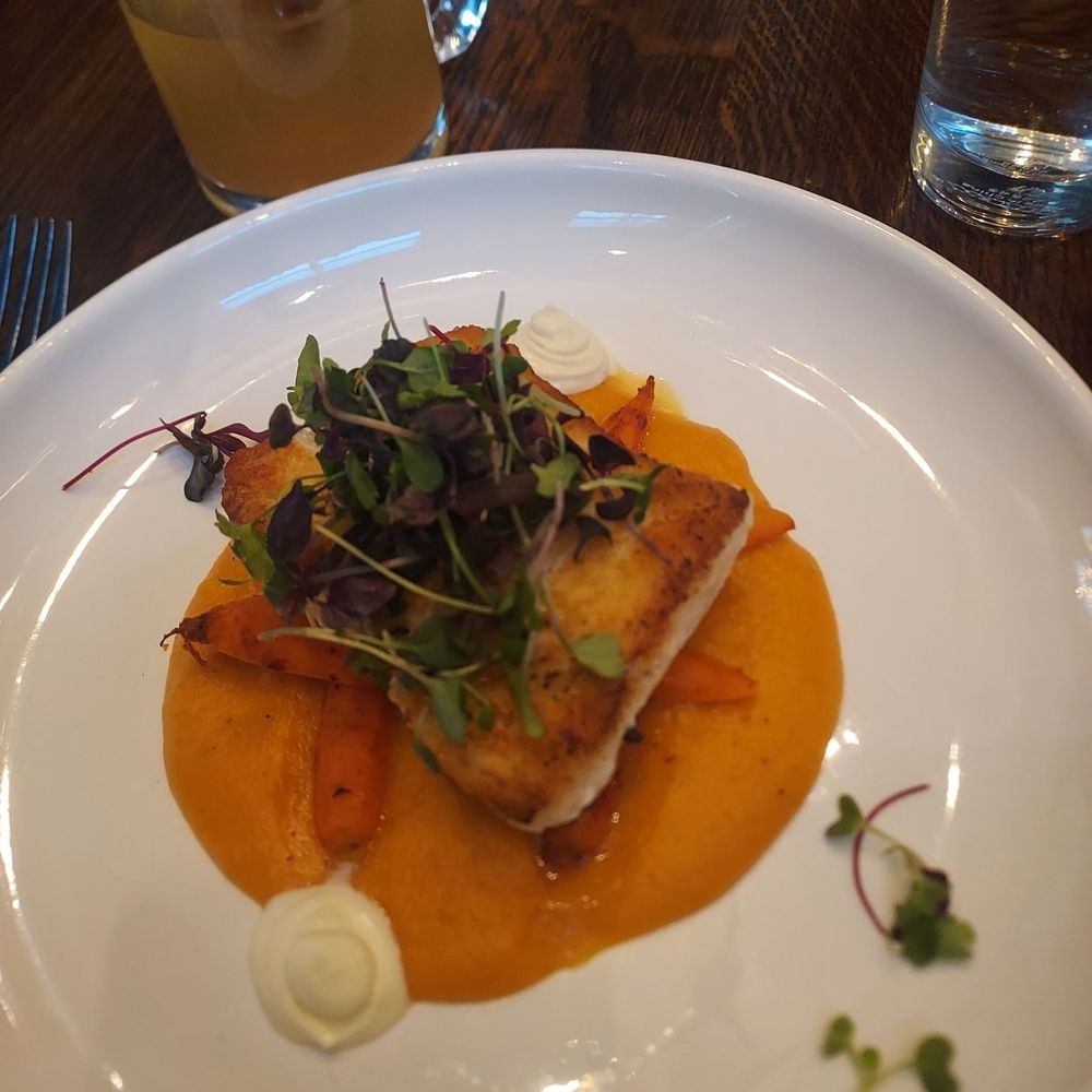Kaneo - Halibut with butternut squash puree, lemon cream freche, micro greens, and harissa carrots. - Mediterranean Near Me - Park City, Utah