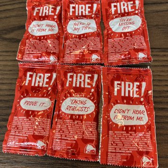 Taco Bell - five packets of fire on a table - Tacos Near Me - Liberty Hill, Texas Taco Bell - five packets of fire on a table - Tacos Near Me - Liberty Hill, Texas
