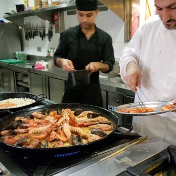 Gaudim - Seafood paella being cooked - Tapas Bars Near Me - Barcelona, B Gaudim - Seafood paella being cooked - Tapas Bars Near Me - Barcelona, B