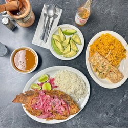 Tropical Taste - Coconut Cod w/yellow rice Fried Snapper w/white rice