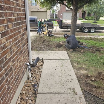 Razo’s Lawn & Landscaping - Front porch angle of them removing the old grass, weeds and tilling. - Landscaping Near Me Razo’s Lawn & Landscaping - Front porch angle of them removing the old grass, weeds and tilling. - Landscaping Near Me