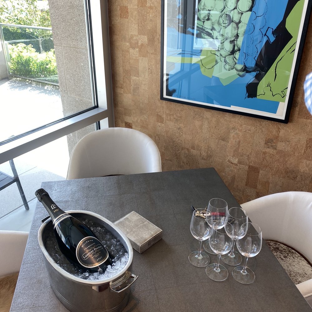 Balthazar Cellars - a table with wine glasses and a bottle of wine - Beer, Wine & Spirits Near Me - Houston, Texas