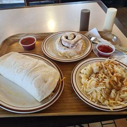 Breakfast burrito cinnamon roll and hash browns