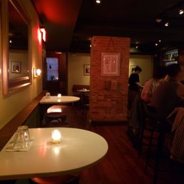 people sitting at tables in a restaurant