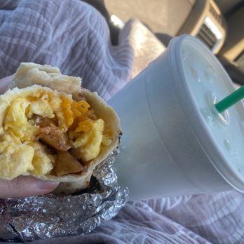 Taqueria Chihuahua - a hand holding a burrito - Mexican Near Me - Giddings, Texas Taqueria Chihuahua - a hand holding a burrito - Mexican Near Me - Giddings, Texas